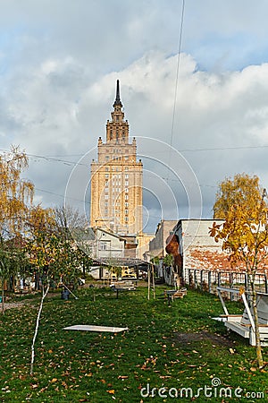 A picturesque autumn scene in the city of Riga, Lithuania, featuring a park with traditional Lithuanian houses Editorial Stock Photo