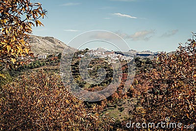 Picturesque autumnal landscape of town in mountains. Cartajima in Malaga, Spain Stock Photo