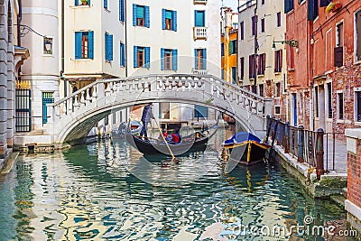 Picturesque canal with a gondola, Venice, Italy Editorial Stock Photo