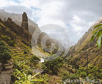 Picturesque canyon Ribeira da Torre covered with lush vegetation. Cultivation on steep terraced hills banana trees Stock Photo