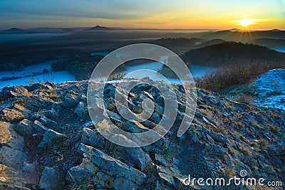 Picturesque colorful ridge of sunrise against the misty hills Stock Photo