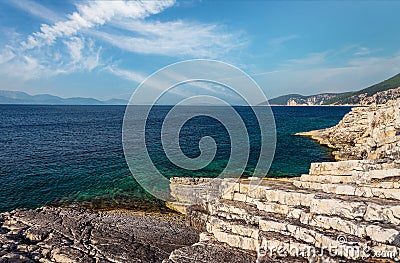 Picturesque Greece landscape. Amazing cliff rocks on the west coast of Ionian sea. Wonderful summer seascape with perfect blue sky Stock Photo