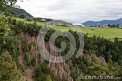 Earth pyramids in front of a scenic landscape of Alto Adige, Northern Italy Stock Photo