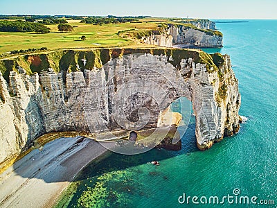 Picturesque landscape of white chalk cliffs and natural arches of Etretat, France Stock Photo