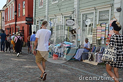 Picturesque old town of Porvoo, Finland - people walking on the cobble stone street Editorial Stock Photo