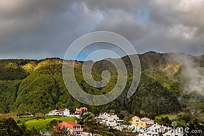 Picturesque park with evaporation from natural active geysers at Stock Photo