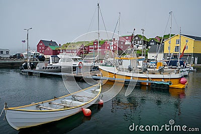 Port view and distant historic buildings in background on Tinganes peninsula in the old town of TÃ³rshavn of the Faroe Islands. Stock Photo