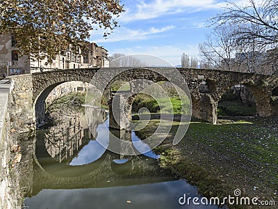 Picturesque roman bridge over Meder river in Vic city Catalonia, Spain Stock Photo
