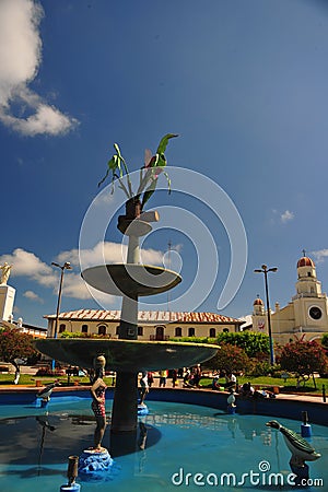 square with a garden of exotic flowers and sculptures of water fountain figures, moyobamba san martin peru -october Editorial Stock Photo