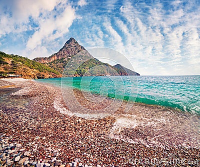 Picturesque summer seascape of Mediterranean sea. Sunny morning view of Adrasan beach with Moses Mountain on background, Turkey, Stock Photo