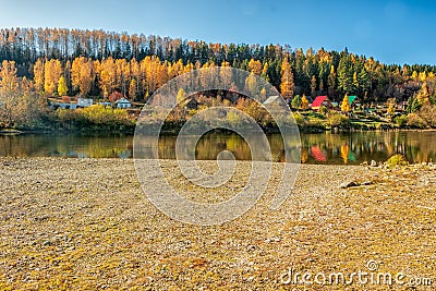 A picturesque view from the bank of the Sylva River on a bright autumn day. Editorial Stock Photo