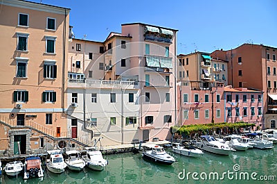 Picturesque view on boats in city channel in Livorno, Italy Stock Photo