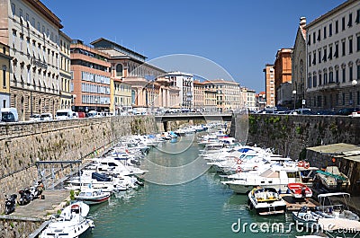 Picturesque view on boats in city channel in Livorno, Italy Stock Photo