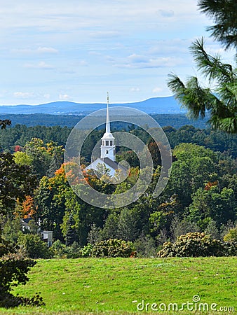 Old Church and steeple on a partly cloudy Fall day in Groton, Massachusetts, Middlesex County, United States. New England Fall. Stock Photo
