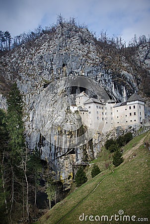 Picturesque view of the Predjama Castle situated in the middle of a towering cliff in Slovenia Stock Photo