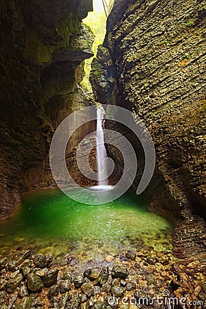 Picturesque view of the rocky amphitheatre with a green pool and a white beam of water. 15-metre-high Kozjak Waterfall Stock Photo