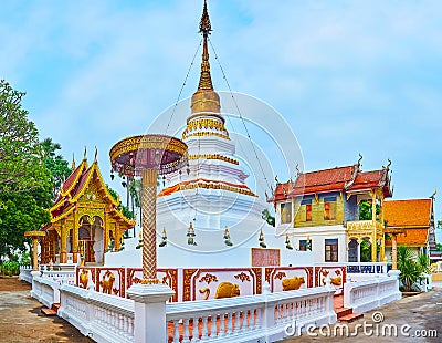 The picturesque white-golden stupa of Wat Sangkharam Temple, Lamphun, Thailand Editorial Stock Photo