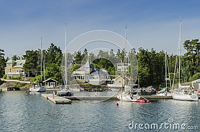 Picturesque yellow holliday houses ArkÃ¶sund Sweden Editorial Stock Photo