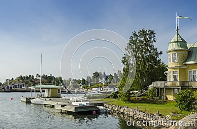 Picturesque yellow holliday houses ArkÃ¶sund Sweden Editorial Stock Photo
