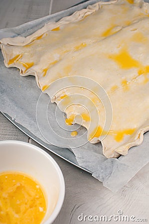 Pie dough baking with egg crust Stock Photo