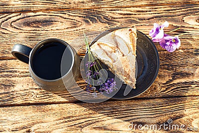 Piece of apple pie with ceramic handmade cup of tea Stock Photo