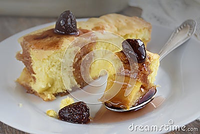 Piece of apple pie with strawberry jam on a white plate. Stock Photo