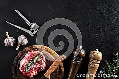 Piece of beef tenderloin, with knife for cutting and chopping meat, spices were cooking - rosemary, pepper, salt, garlic Stock Photo