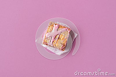 Piece of cake with ruby chocolate on pink background Stock Photo