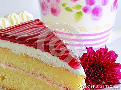 PIECE OF CAKE and violet flower Stock Photo