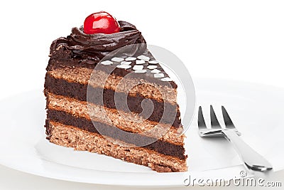 Piece of chocolate cake decorated with cherry. Stock Photo