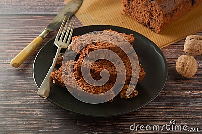 Piece of chocolate cake , fudge or pound cake. Wooden background Stock Photo
