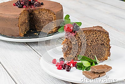 Piece of Chocolate cake with Ganache and berries fruit Stock Photo