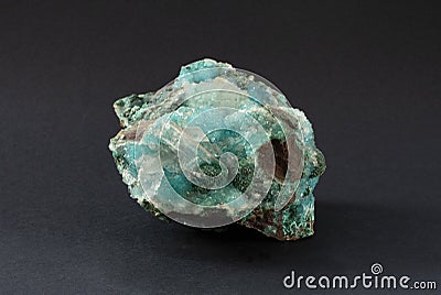 Piece of Chrysocolla mineral with quartz and gypsum, blue turquoise crystals. Stock Photo