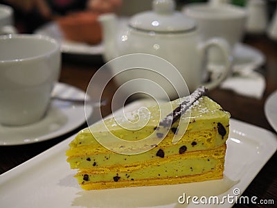 Piece of delicious diet banana and pistachio cake beautifully served in the restaurant Stock Photo