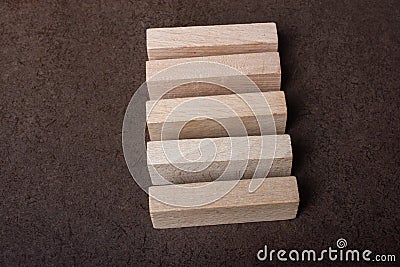 Piece of domino made of wood on dark background Stock Photo