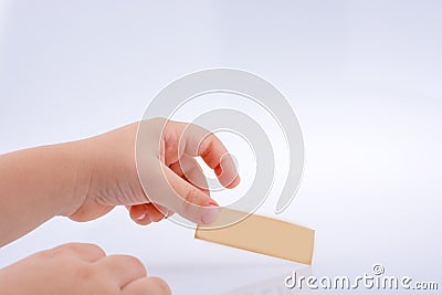 Piece empty paper in hand Stock Photo