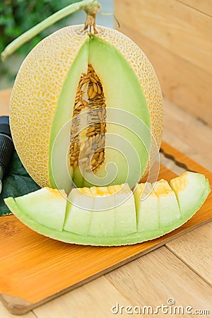 Piece of fresh yellow galia melon Stock Photo