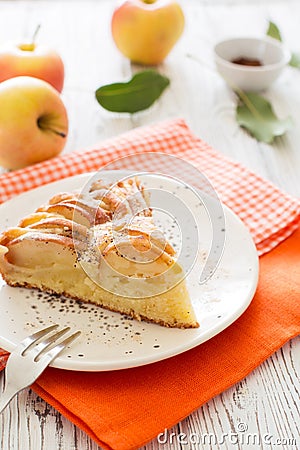 Piece of homemade apple pie on a white wooden background Stock Photo