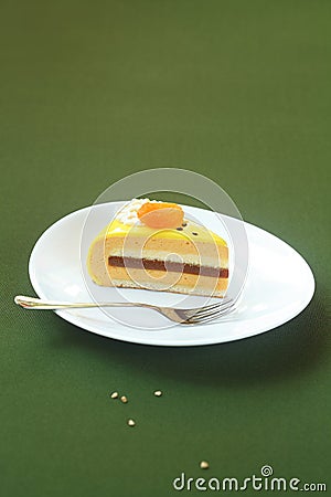 Piece of Honey, Sea-buckthorn and Apricot Yellow Entremet Cake Stock Photo