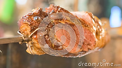 piece of a lamb meat on a rotating grill Stock Photo
