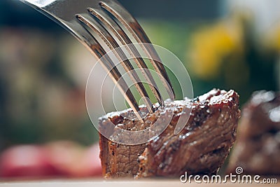 Iece of meat on a fork Stock Photo