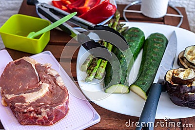 Piece of meat and vegetables preparing barbecue Stock Photo