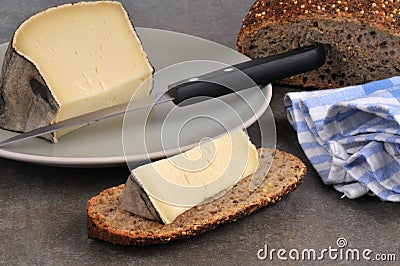 French mountain tomme on a slice of bread Stock Photo