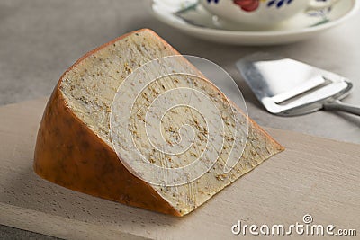 Piece of old mature cumin cheese Stock Photo