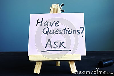 Piece of paper with sign Have questions Ask Stock Photo