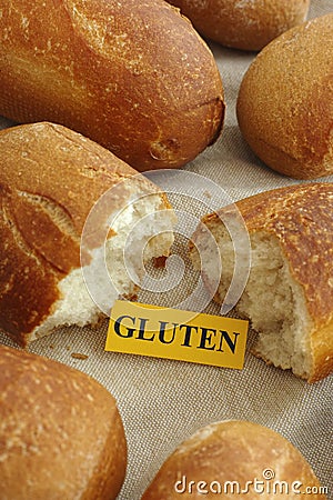 Piece of paper with the word gluten in a bun Stock Photo