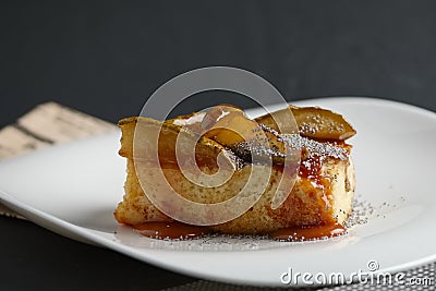 Piece of pear pie with poppy and sauce Stock Photo