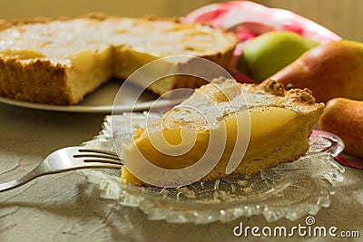A piece of pear tart. Autumn pear cake. Close-up. Stock Photo