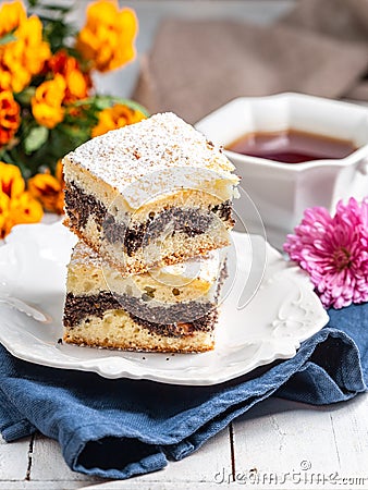 Piece of Poppy Seed Cake on the White Plate Stock Photo