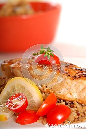 Piece of seared halibut over brown rice Stock Photo